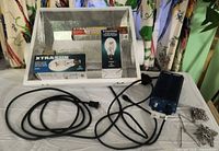 Overall lot showing reflector, ballast, bulbs, hardware