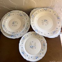 Stacks of Arcopal Romantique plates on table