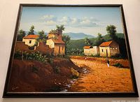 Front view of framed landscape painting