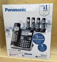 Front of sealed retail box showing Panasonic KX-TGF575S system with five handsets