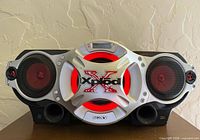 Front view showing speakers, branding, condition