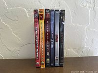 All six DVD spines visible for title identification