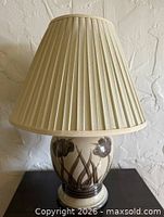 Full view of stoneware lamp with shade