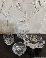 Group view of four cut glass pieces