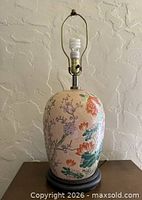 Full view of ginger jar lamp on wooden base