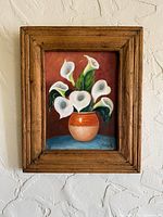 Full view of framed painting on wall