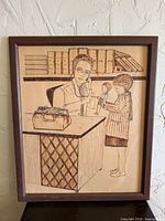 Full view of framed wood etching artwork