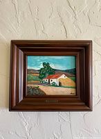Full view of framed artwork showing landscape scene and wood frame