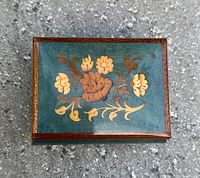 Top view showing floral marquetry and overall finish