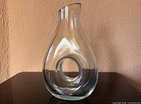 front view of clear glass eternity pitcher showing central hole