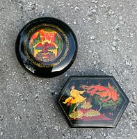 Round and hexagonal Russian lacquer boxes side by side