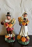Front view of both pilgrim figurines