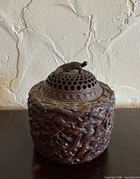 Full view of bronze incense burner front