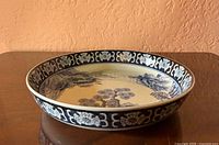 Oblique view showing exterior side wall and decorative rim