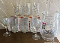 Entire set: six tumblers, wine glass and pitcher displayed