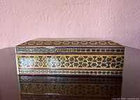 Front view of inlaid wooden box