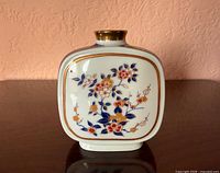 Front view showing floral decoration and gold rim