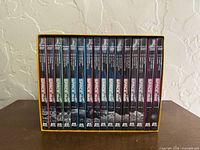Front view showing all 17 numbered DVD cases inside slipcase