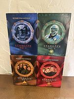 Front view of four Stargate SG-1 DVD slipcases Seasons 1-4