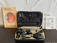 Closed view of diagnostic set in case with manuals