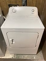 Full front view of Amana white electric dryer