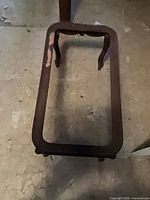 Top view of rectangular wooden coffee table frame missing top