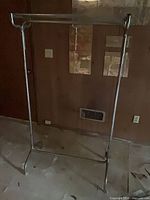 full frontal view of chrome clothing rack showing overall structure