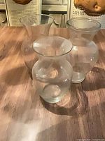 Group shot of all three clear glass trumpet vases