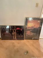 Both framed prints side by side showing relative sizes and frames