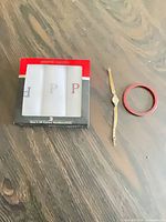 Lot overview showing boxed handkerchiefs, watch, bangle