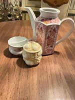 Group shot of Ridgway pitcher, floral teacup and lidded grape-cluster container
