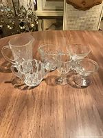 Group shot of all six clear glass pieces on table