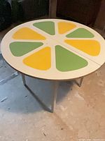 Top view showing painted citrus wedge motif and overall surface condition