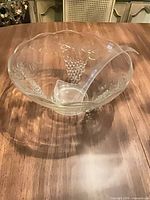 Overhead view of glass punch bowl and plastic ladle