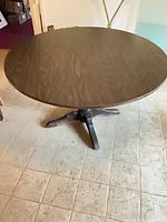 Top view of round dark brown veneer dining table