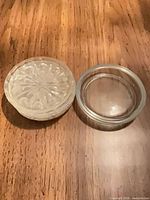 stack of coasters beside single inverted coaster showing starburst design