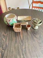 All five planters grouped on table