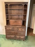 Full view of solid wood hutch showing shelving and drawers