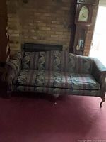 Front view of multicolor tapestry sofa