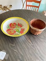 Top view of enamel bowl and wooden basket