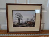 front view of framed print with ruler for scale