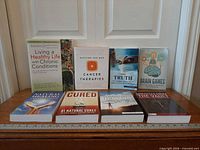 All eight books displayed upright for overall view