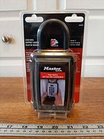 Front view of sealed Master Lock 5422D lock box in packaging