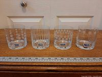Full set of four etched Mikasa Cheers glasses with ruler for scale