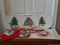 Full group of placemats, mitts, pot holder, tablecloth, poinsettias