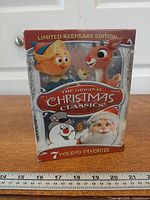 Front view of sealed box set showing title and characters