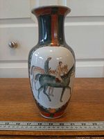 Full front view of vase with ruler indicating height