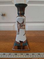 Full front view showing horse and rider illustration, square tapered shape, measurement scale