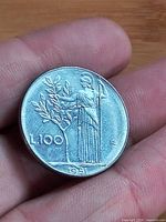 Reverse side showing Minerva with olive tree, denomination L.100 and date