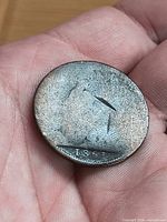 Reverse side of 1861 half penny showing worn Britannia and date